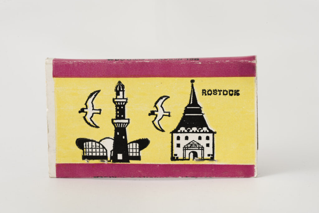 match box, motifs lighthouse in Warnemünde and th "Kuhtor" in Roststock