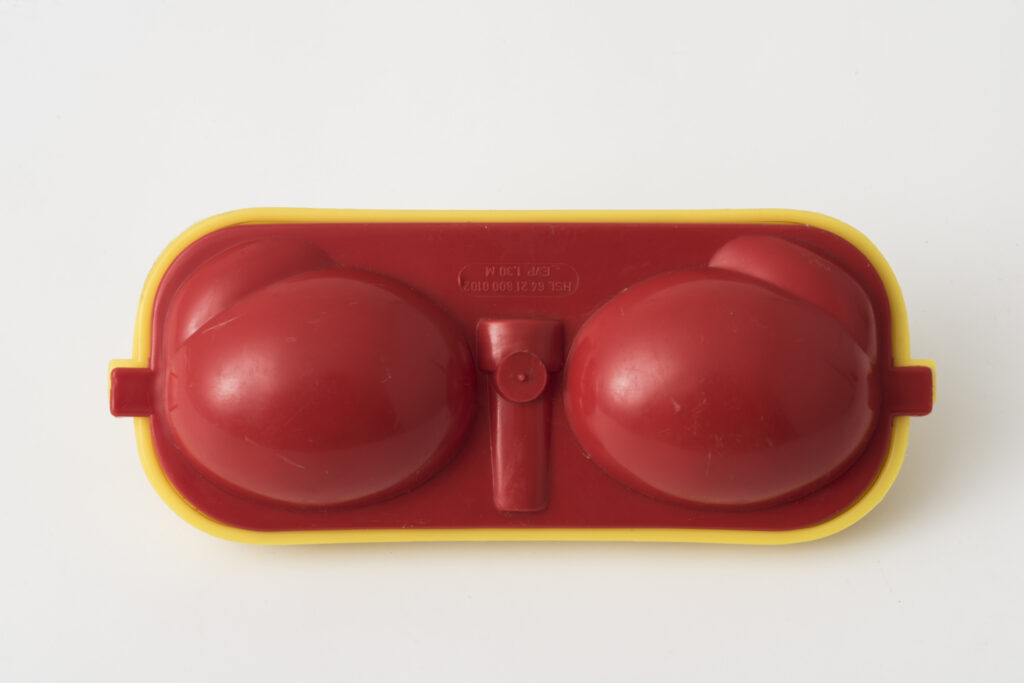 Egg box for two eggs made of yellow and red plastic