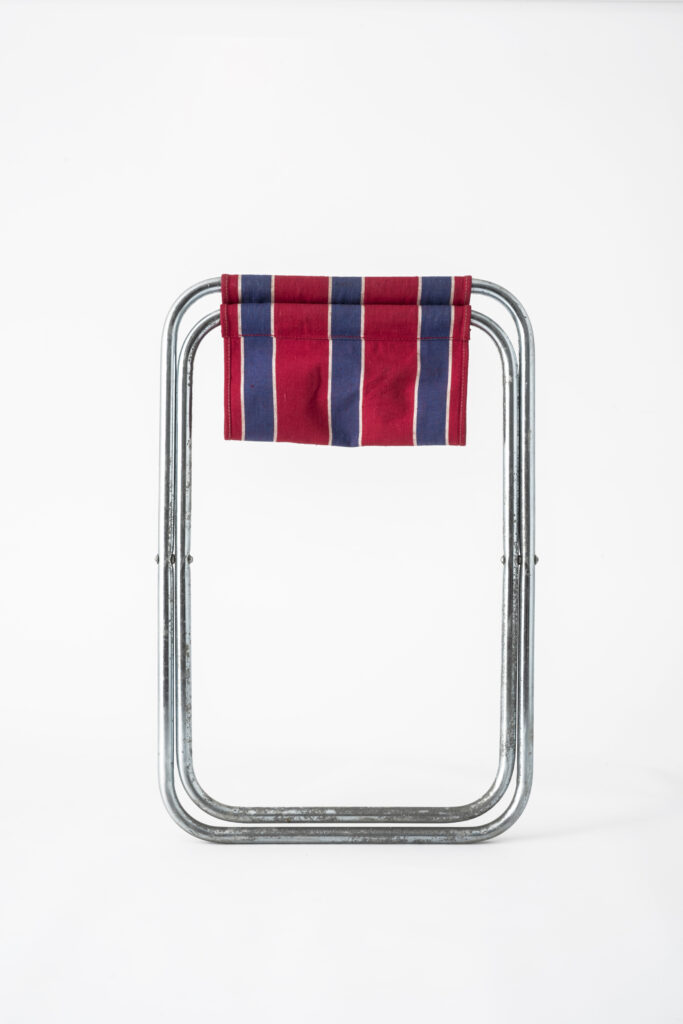 Folding stool with fabric seat, fold