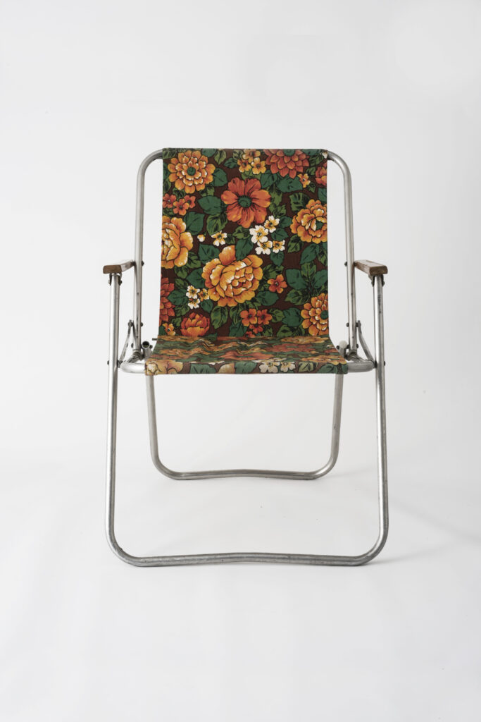 Folding chair with fabric seat, unfold, frontal view